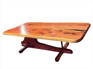 Continuum Table by Sculptera in cedar, three-quarter view from above: a glossy tabletop on a carved sculptural base